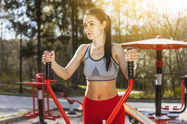 Young woman doing outdoors excercises Free Photo